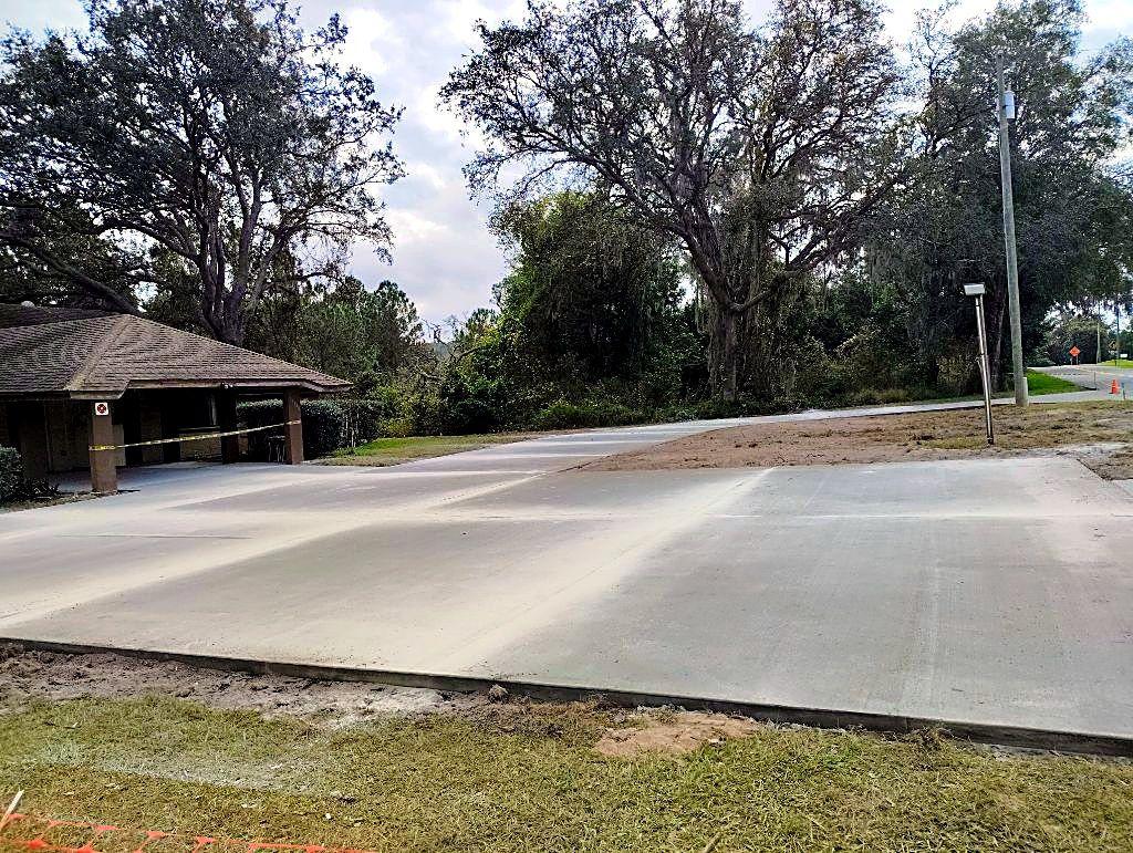 Newly poured broom-finish concrete driveway in Clermont FL by RRV Construction
